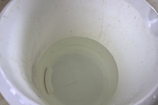 Bucket filled with water at room temperature Bucket filled with water at room temperature