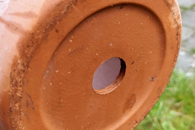 Terracotta pot with a drainage hole