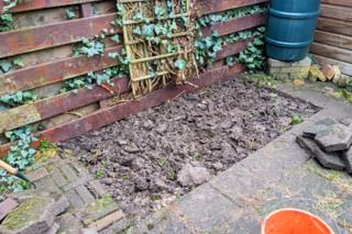 Removing tiles in an ugly corner of the garden Removing tiles in an ugly corner of the garden